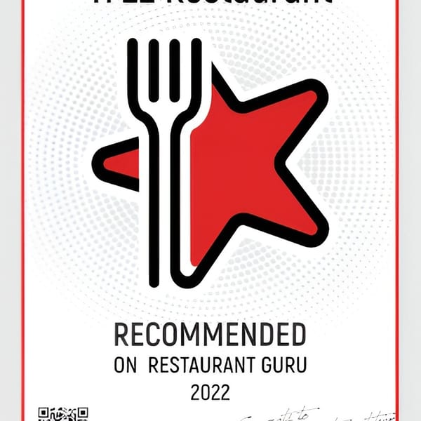 Ti 22 Restaurant's 2022 Restaurant Guru recommendation certificate, featuring a fork and red star logo.