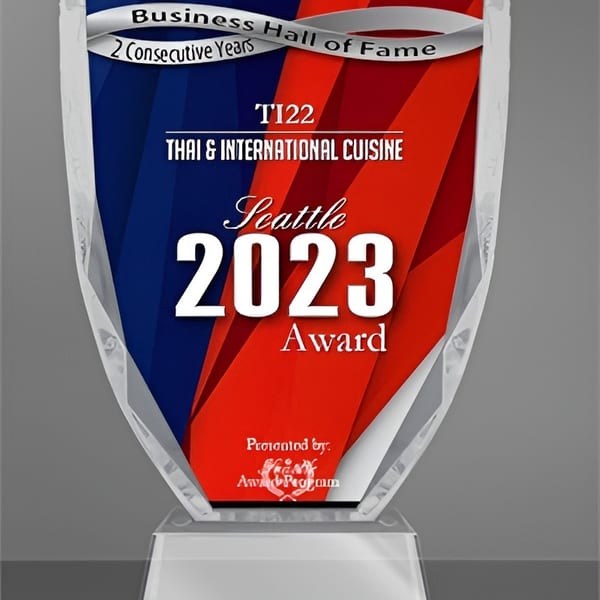 A clear acrylic award for "Business Hall of Fame" for "Thai & International Cuisine" in Seattle, 2023.