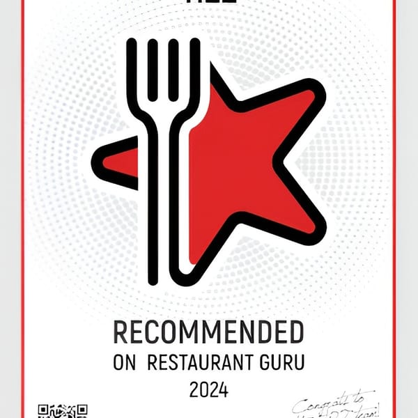 Ti22 restaurant received a "Recommended on Restaurant Guru 2024" award, featuring a fork and red star logo.
